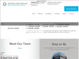 woodlandsmilesdental.com